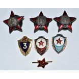 A collection of replica Soviet Order of the Red Star badges etc