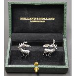A pair of Holland & Holland stainless steel cufflinks in the form of stags, in original fitted