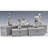 Five Lladro figures angel / putti, girl holding piglet and child with lamb, all boxed, tallest 18cm