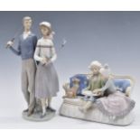 Two Lladro figural groups, one 'Ninos del Sofa' the other two golfers, both boxed, tallest 34cm