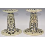 Dennis Chinaworks pair of signed limited edition no 1 and 2 of 26 lustre candlesticks decorated in