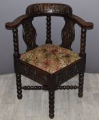 Victorian carved oak corner chair with motto ‘sit at ease’ to back