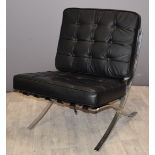 Barcelona style designer chair with chrome or similar frame and black buttoned upholstery