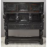 Elizabeth I / Tudor jointed oak and parquetry inlaid figurally decorated canted court cupboard,