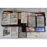A box of world stamps and first day covers in albums, folders and loose.