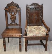 Two antique carved oak hall chairs, the larger having peg joints