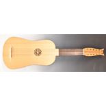 A reproduction Baroque style Vihuela 12 string guitar, retailer's label inside Gordon Saunders,