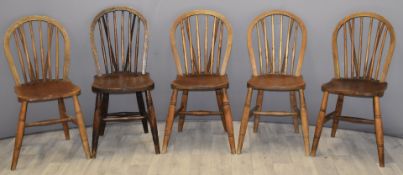 Set of four wheel back Windsor dining chairs