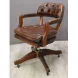 Captain's or office desk chair with Chesterfield style faux leather upholstery, on adjustable