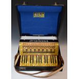 Fremielio piano accordion, 1930s German made 24 bass, in red marbled finish, original label to case,