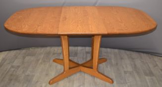 Ercol light elm extending dining table, maximum length 166cm x W110 x H74cm