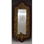 French style 19thC pier mirror with mask decoration and triple candle sconce, mounted on a velvet