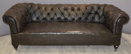 Leather Chesterfield sofa with turned front legs and castors stamped Hampton & Son, L210cm