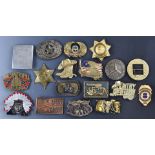 Eighteen mainly American novelty and police related belt buckles including Winchester Repeating