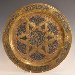 Cairoware style brass charger with applied copper and silver decoration, 32.8cm in diameter.