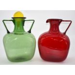 Two Polspotten jugs, one green with twin handles and yellow stopper the other red, tallest 43cm