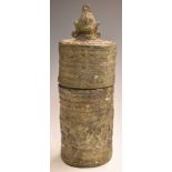 Benin bronze tribal casket with embossed figural decoration and figural finial, 29cm tall