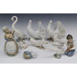 Nine Lladro and Nao figures, some boxed, tallest 24cm