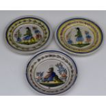 Three 19thC Quimper faience wall plaques with figural decoration, diameter 23cm