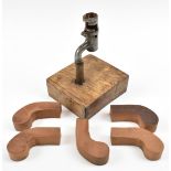 A candlestick in the form of a bayonet mounted in wooden block, together with five mahogany pocket