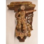 Eastern figural temple bracket with gilt and jewelled decoration, 33cm tall.