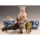 Two Chinese blue and white ginger jars, one decorated with prunus blossom, carved hardwood figural