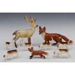Nine Beswick animals comprising six hounds, two foxes and a deer, tallest 20cm