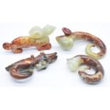 Four Chinese carved green and russet jade / hardstone figures and pendants, tallest 9.5cm