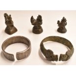 Three bronze opium weights in the form of cockerels together with two bronze and white metal