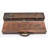 Two leather bound shotgun carry cases, one with 'William Moore & Grey Gun Manufactures 43 Old Bond