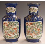 Pair of 19thC Chinese pedestal vases with enamelled decoration of mounted riders / battle scenes,