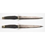 A pair of stag handled hunting daggers with 18cm blades. PLEASE NOTE ALL BLADED ITEMS ARE SUBJECT TO