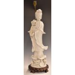 Chinese 19thC blanc de chine figure of Guanyin, converted to a lamp, on carved wooden base, 63cm