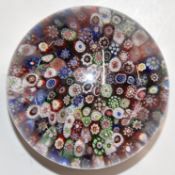 Baccarat close packed millefiori glass paperweight with multi-coloured canes, 64mm in diameter
