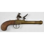 Flintlock pistol with line engraved brass lock, thumb slide safety, walnut grip and 5 inch smooth