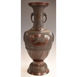 Japanese bronzed pedestal vase with twin stylised elephant handles decorated with auspicious