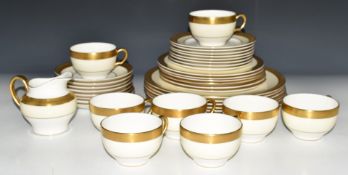 Thirty eight pieces of Minton dinner and teaware decorated in the Buckingham pattern, six place