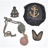 Three Royal Navy bullion and cloth badges, identity discs for T McEwan 14757701 and an economy issue