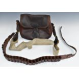 Leather 100 shotgun cartridge bag with canvas strap and a similar 12 bore shotgun cartridge belt.