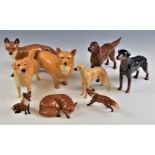A collection of Beswick dog and fox figures, tallest 11cm