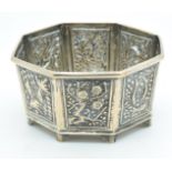 Chinese silver octagonal pot with embossed foliate decoration and character marks to base, width 7.