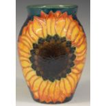 Dennis Chinaworks signed trial vase decorated with sunflowers on a green ground, H13.5cm