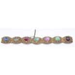 Chinese silver gilt filigree bracelet set with jade, sapphire, tourmaline, ruby and garnet cabochons
