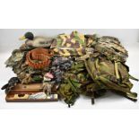 A collection of Realtree and similar camouflage clothing and accessories including Advantage ghillie
