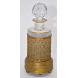 French gilt metal musical box scent bottle holder with embossed decoration, cut glass stopper and