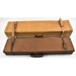 Two shotgun carry cases comprising an Arco leather double motor case with coded lock (86x22x13cm)