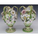 Pair of 19thC Coalbrookdale ewers with applied flower decoration, H32cm