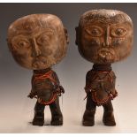 Tikar of Cameroon, Africa pair carved wooden pygmy figures, the bodies carved in a squat position