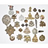 Small collection of metal badges including London Rifle Brigade, Royal Artillery, Scots Guards,