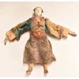Chinese 19thC carved and jointed doll with embroidered clothing, 26cm tall.